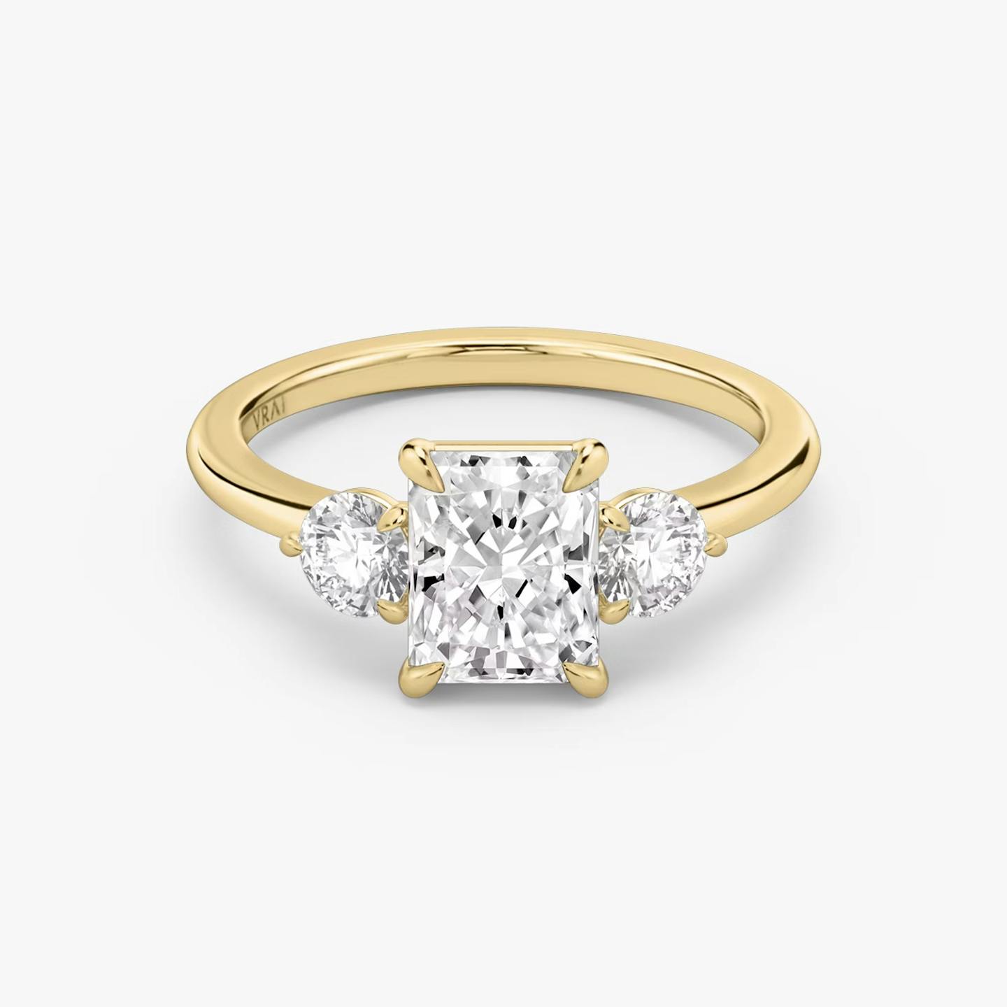 The Three Stone | Radiant | 18k | 18k Yellow Gold | Band: Plain | Side stone carat: 1/4 | Side stone shape: Round Brilliant | Diamond orientation: vertical | Carat weight: See full inventory
